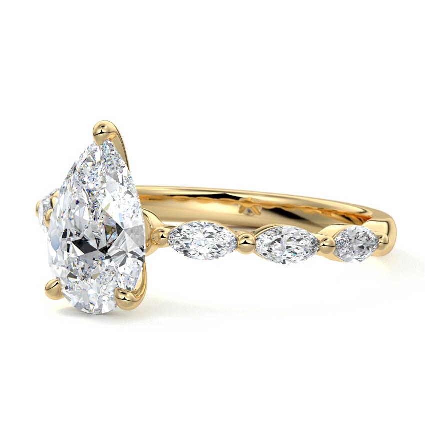 Yellow gold Pear Diamond Side Stone Engagement Ring