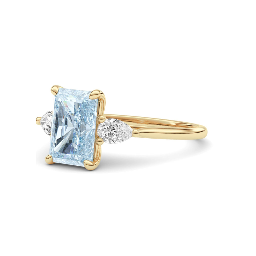 Yellow gold Three-Stone Fancy Blue Radiant Cut Diamond Ring with Pear Side Stones