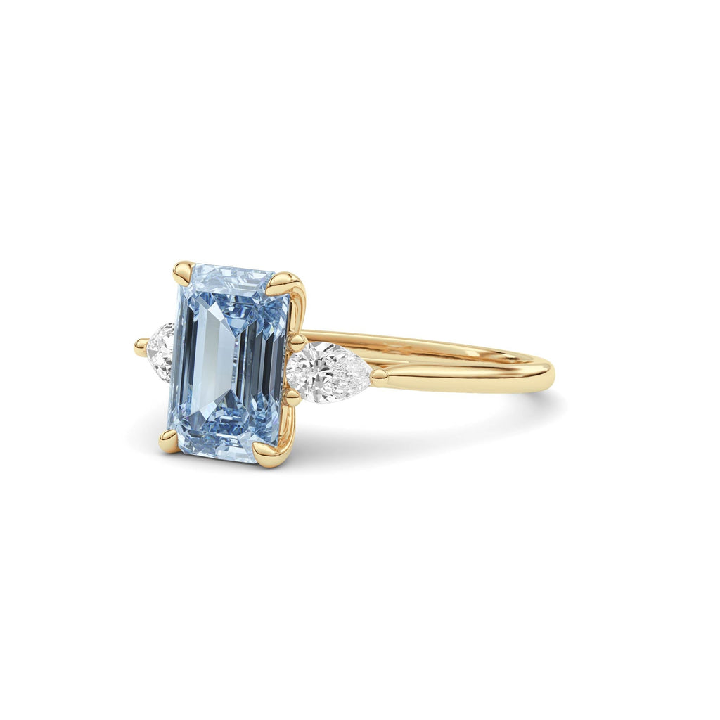 Yellow gold Three-Stone Fancy Blue Emerald Cut Diamond Ring with Pear Side Stones