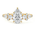 Yellow gold Pear Solitaire Diamond Engagement Ring with Floral Cluster Side Stones and Pave Band