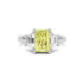 White gold Three-Stone Fancy Yellow Radiant Cut Diamond Ring with Step-Cut Side Stones