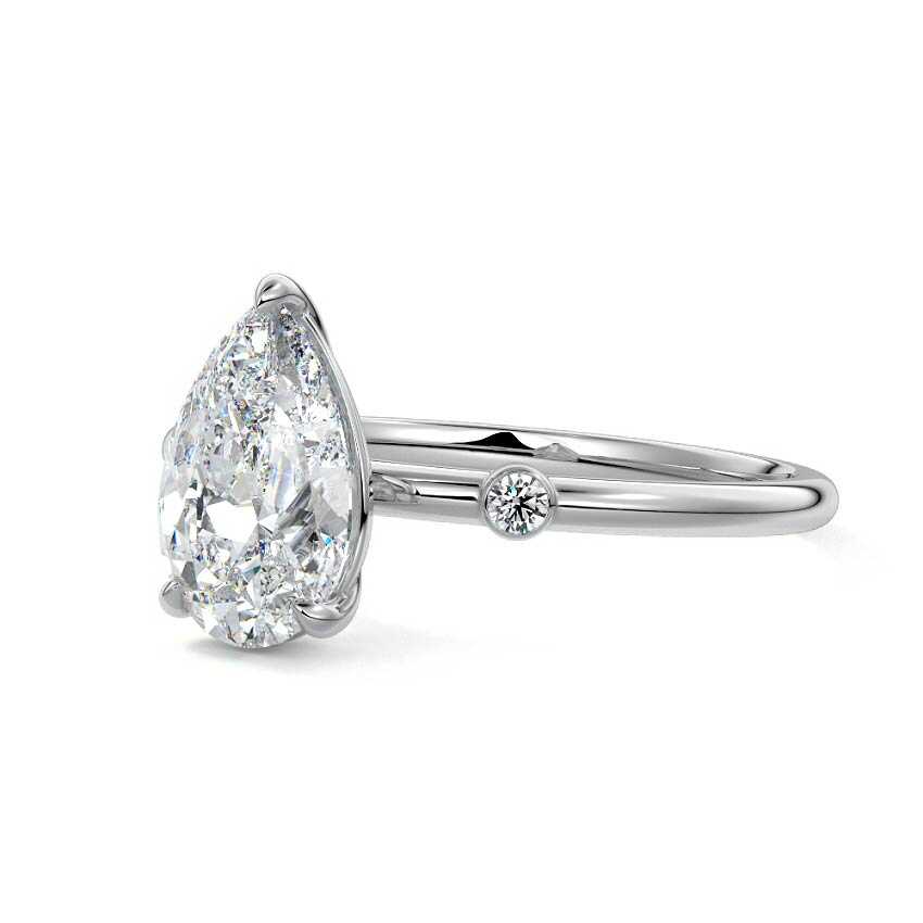 Silver Pear Diamond Side Stone Ring with Round Accents