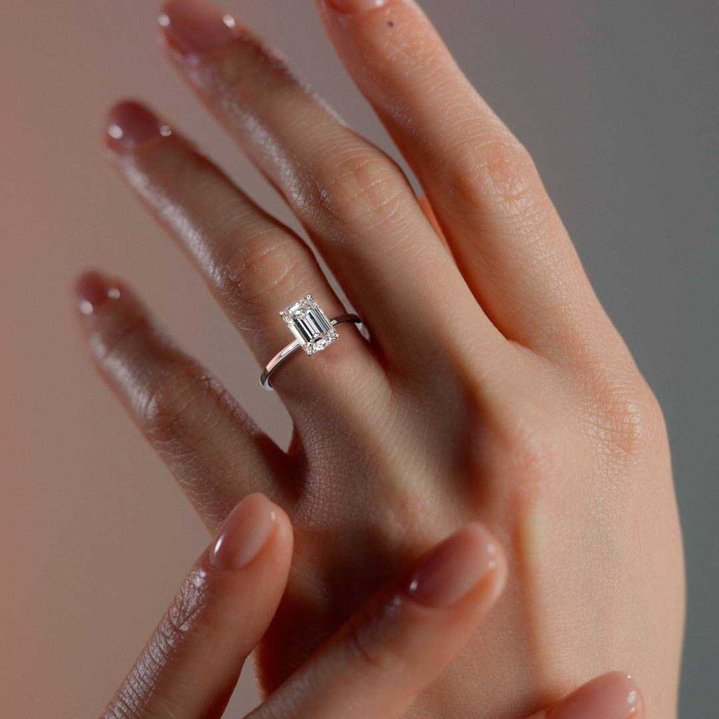 Platinum Emerald Diamond Solitaire Engagement Ring with Hidden Halo