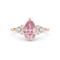 Rose gold Fancy Pink Pear Cut Three Stone Diamond Engagement Ring with Tapered Baguette and Round Side Stones