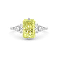 Yellow gold Fancy Yellow Radiant Cut Three Stone Diamond Engagement Ring with Tapered Baguette and Round Side Stones
