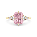 Yellow gold Fancy Pink Radiant Cut Three Stone Diamond Engagement Ring with Tapered Baguette and Round Side Stones