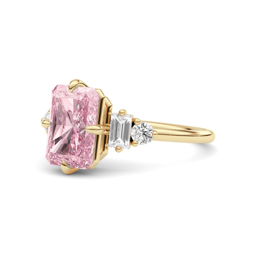 Yellow gold Fancy Pink Radiant Cut Three Stone Diamond Engagement Ring with Tapered Baguette and Round Side Stones
