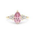 Yellow gold Fancy Pink Pear Cut Three Stone Diamond Engagement Ring with Tapered Baguette and Round Side Stones