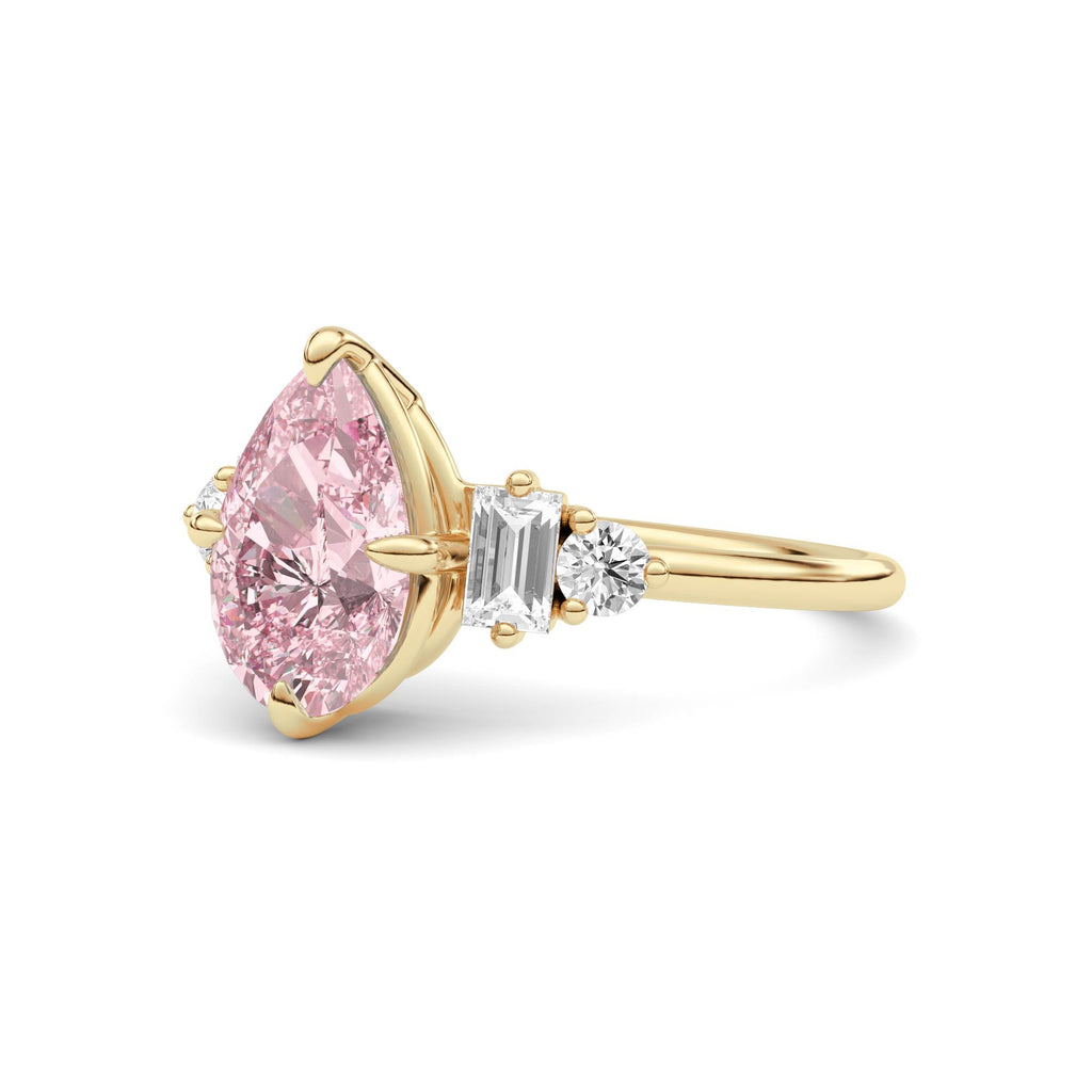 Yellow gold Fancy Pink Pear Cut Three Stone Diamond Engagement Ring with Tapered Baguette and Round Side Stones