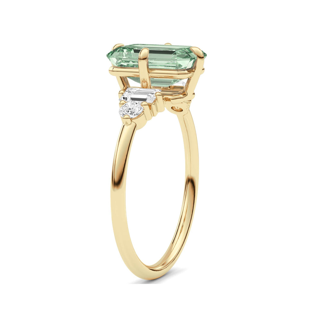 Yellow gold Fancy Green Emerald Cut Three Stone Diamond Engagement Ring with Tapered Baguette and Round Side Stones