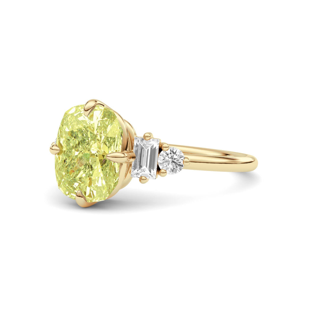 Yellow gold Fancy Yellow Cushion Cut Three Stone Diamond Engagement Ring with Tapered Baguette and Round Side Stones