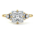 Yellow gold Princess Three Stone Diamond Engagement Ring with Tapered Baguette and Round Side Stones