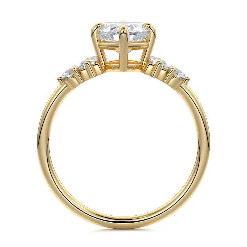 Yellow gold Heart Three Stone Diamond Engagement Ring with Tapered Baguette and Round Side Stones