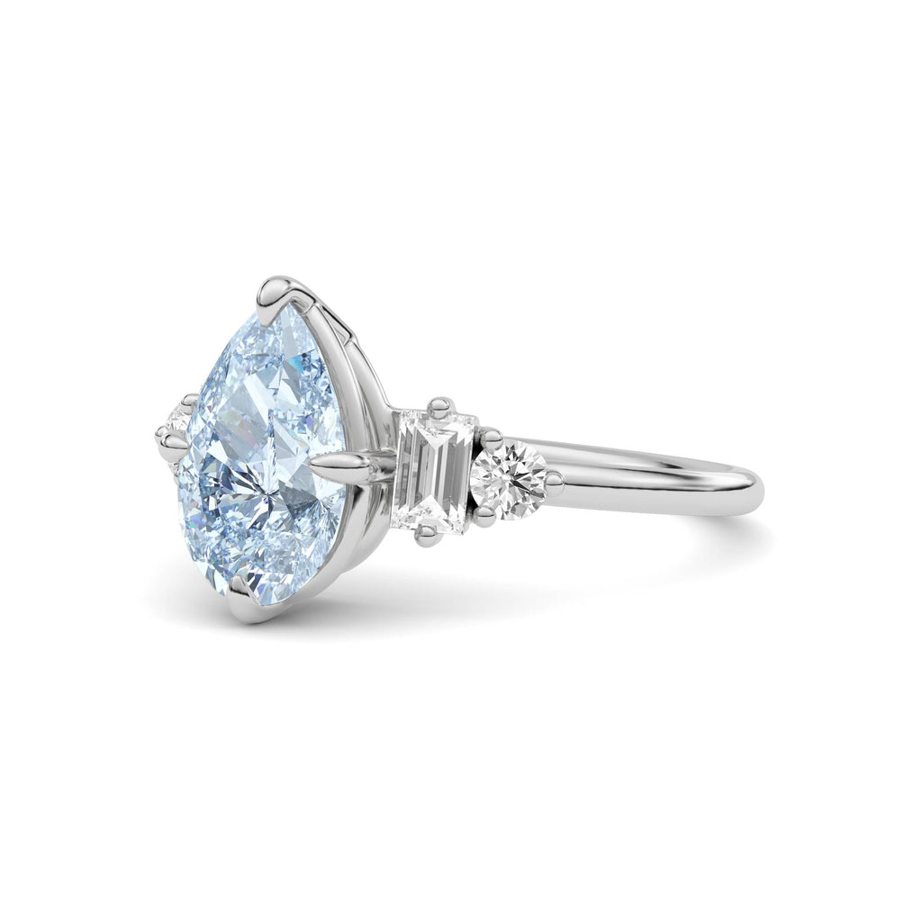 White gold Fancy Blue Pear Cut Three Stone Diamond Engagement Ring with Tapered Baguette and Round Side Stones