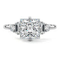 White gold Princess Three Stone Diamond Engagement Ring with Tapered Baguette and Round Side Stones
