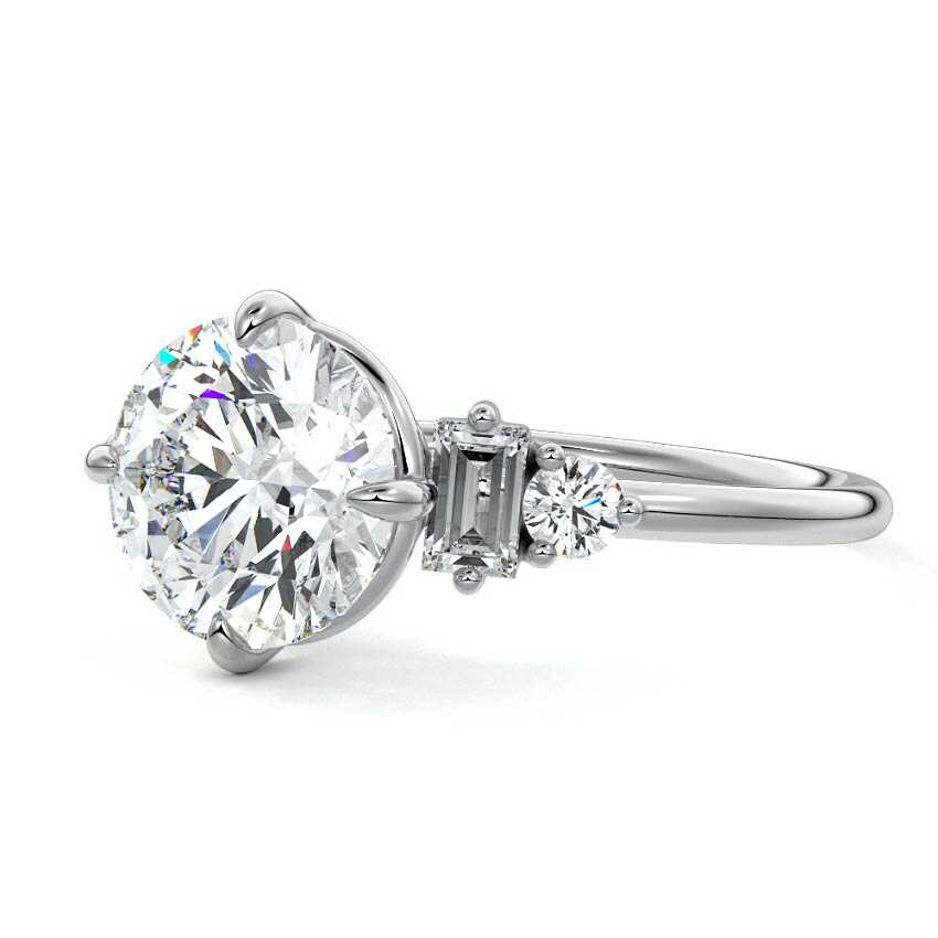 Platinum Round Three Stone Diamond Engagement Ring with Tapered Baguette and Round Side Stones