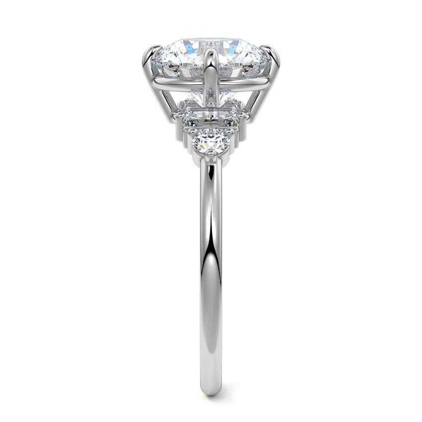 Platinum Round Three Stone Diamond Engagement Ring with Tapered Baguette and Round Side Stones