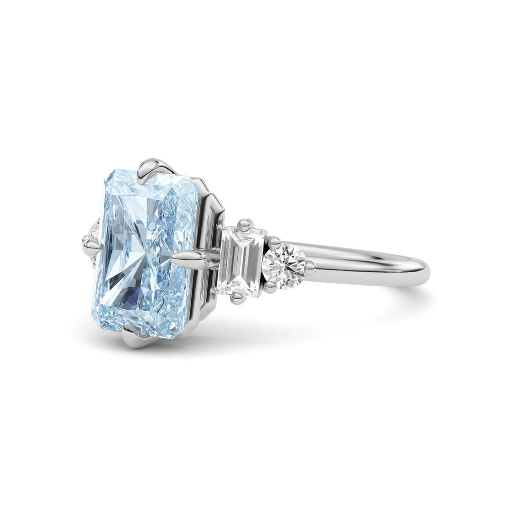 Platinum Fancy Blue Radiant Cut Three Stone Diamond Engagement Ring with Tapered Baguette and Round Side Stones