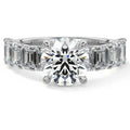Silver Round Diamond Engagement Ring with Emerald-Cut Side Stones and Prong Setting