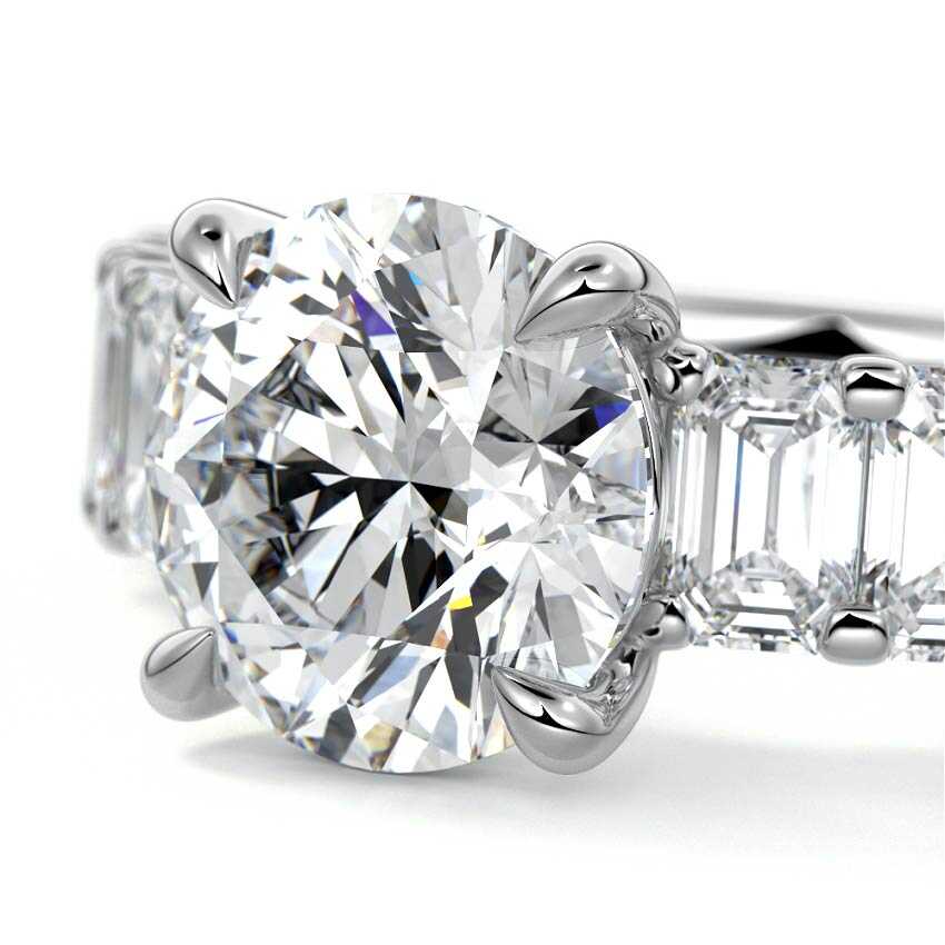 Silver Round Diamond Engagement Ring with Emerald-Cut Side Stones and Prong Setting