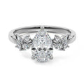 Platinum Pear Diamond Side Stone Ring with Cluster Marquise and Round Accents