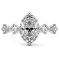 Silver Oval Diamond Side Stone Ring with Round Prong Set Accents