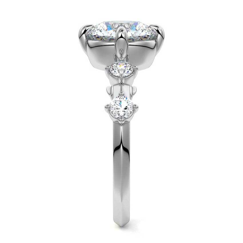 Platinum Round Diamond Side Stone Ring with Round Prong Set Accents