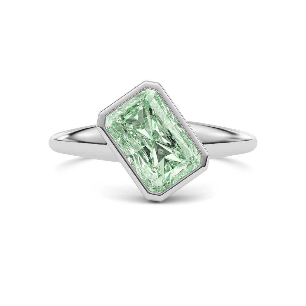 White gold Fancy Green Radiant Cut Diamond Solitaire Engagement Ring with East-West Bezel Setting