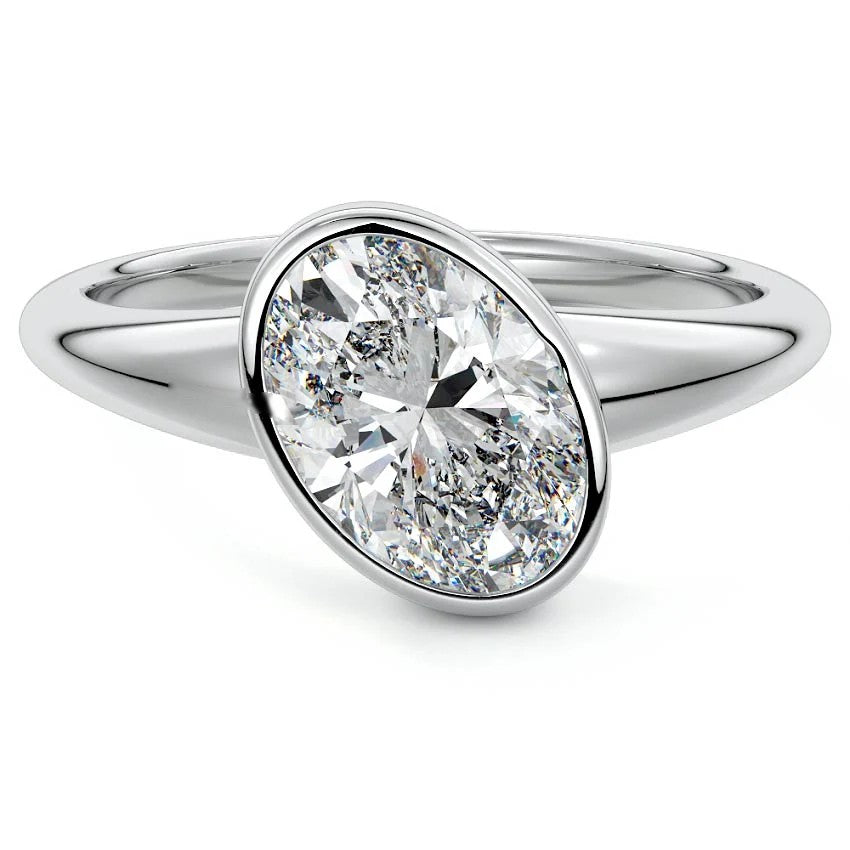 White gold Oval Diamond Solitaire Engagement Ring with East-West Bezel Setting 