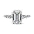 White gold Emerald Diamond Side Stone Engagement Ring with Hidden Halo and Cluster Accents