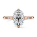 Rose gold Oval Diamond Side Stone Ring with Flush Set Round Accents in Prong Setting