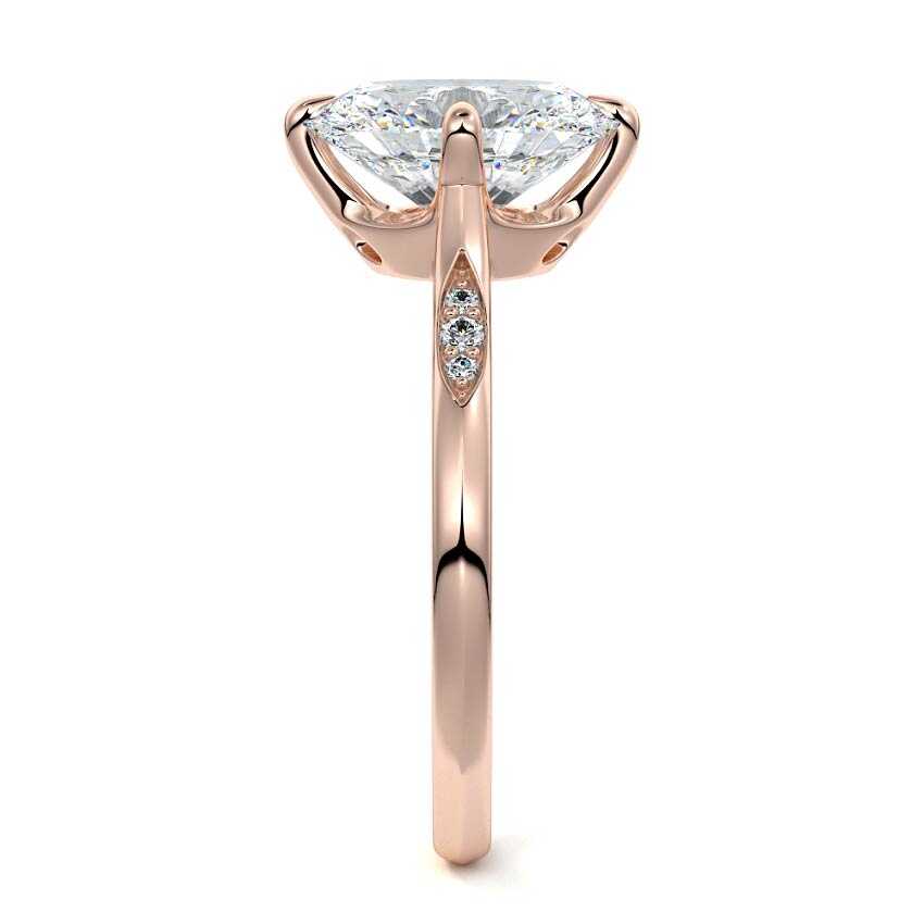 Rose gold Oval Diamond Side Stone Ring with Flush Set Round Accents in Prong Setting