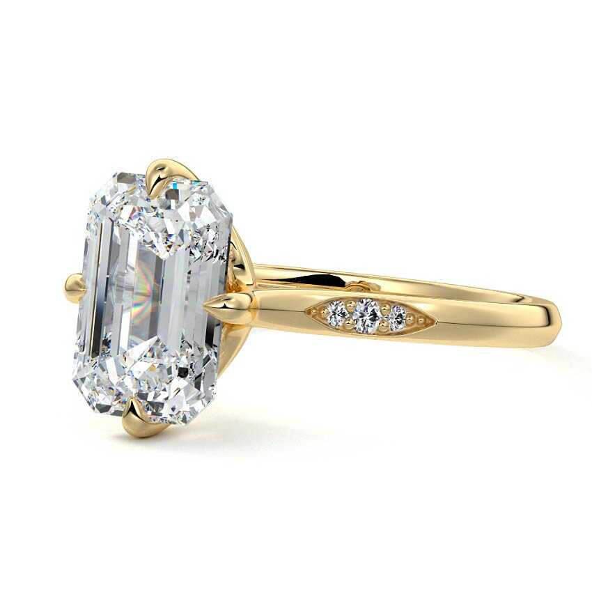 Yellow gold Emerald Diamond Side Stone Ring with Flush Set Round Accents in Prong Setting