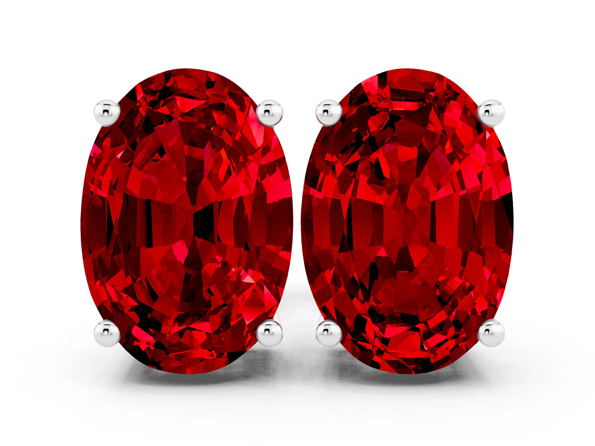 Oval Cut Ruby Stud Earrings in Platinum with Basket Setting