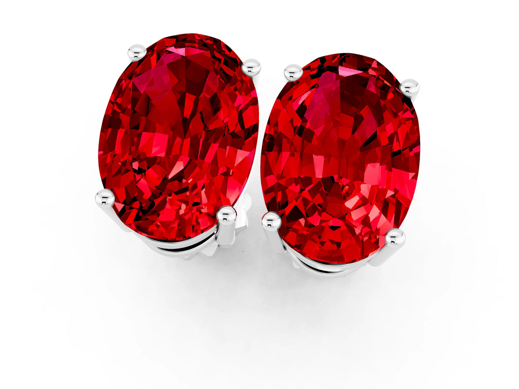 Oval Cut Ruby Stud Earrings in Silver with Basket Setting