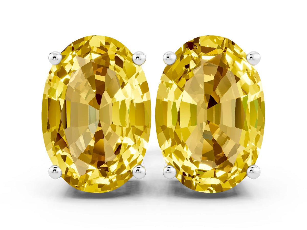Oval Cut Yellow Sapphire Stud Earrings in Silver with Basket Setting