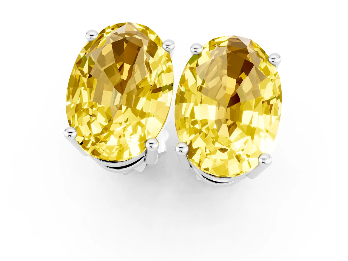 Oval Cut Yellow Sapphire Stud Earrings in Silver with Basket Setting