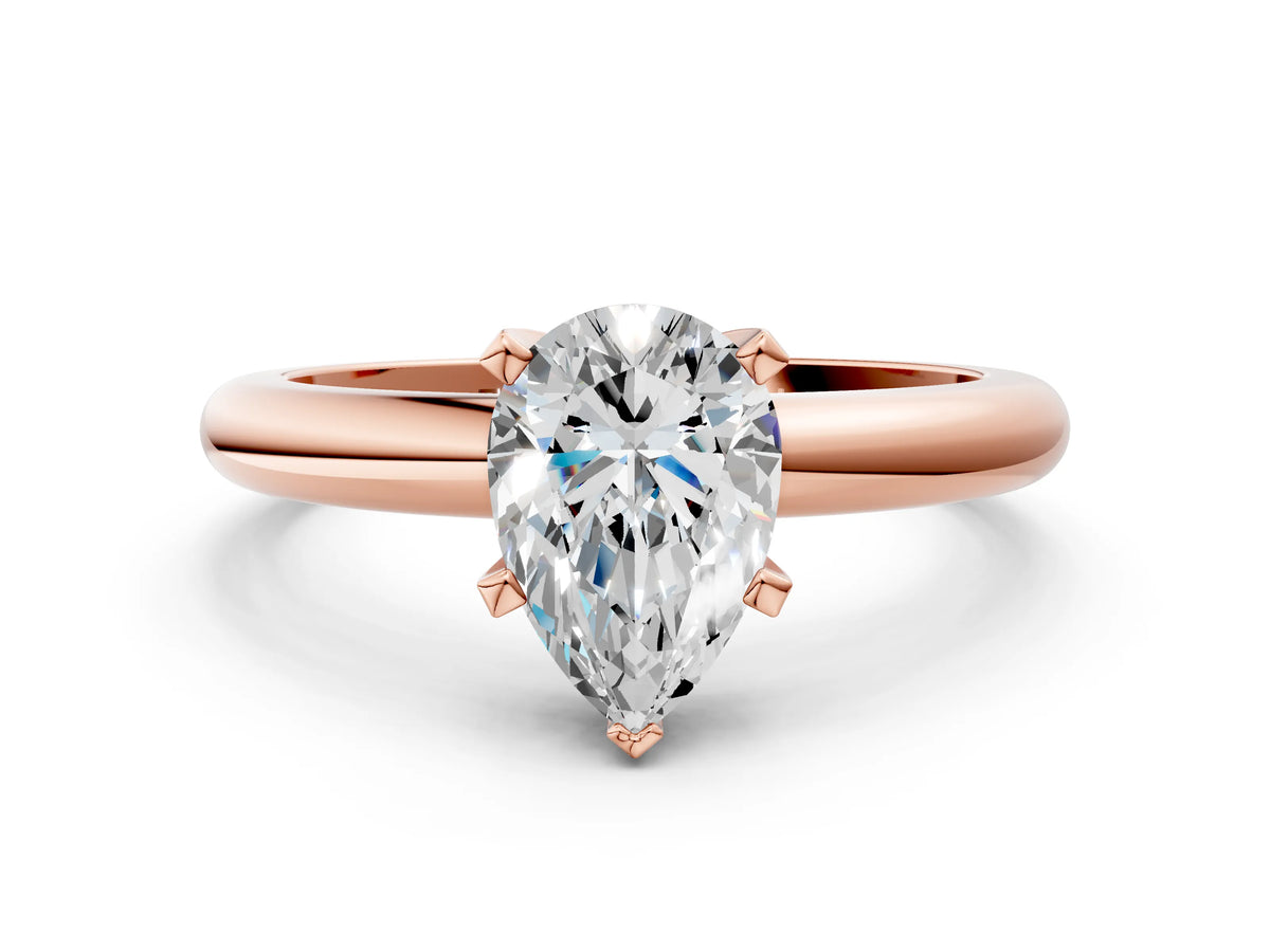 Pear Cut Diamond Solitaire Ring in Rose gold with Prong Setting and Rounded Band