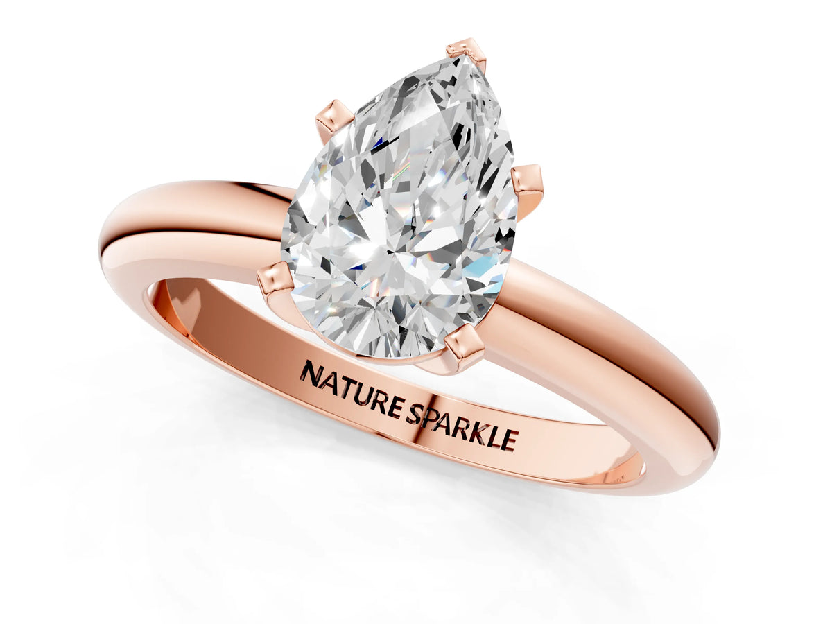 Pear Cut Diamond Solitaire Ring in Rose gold with Prong Setting and Rounded Band