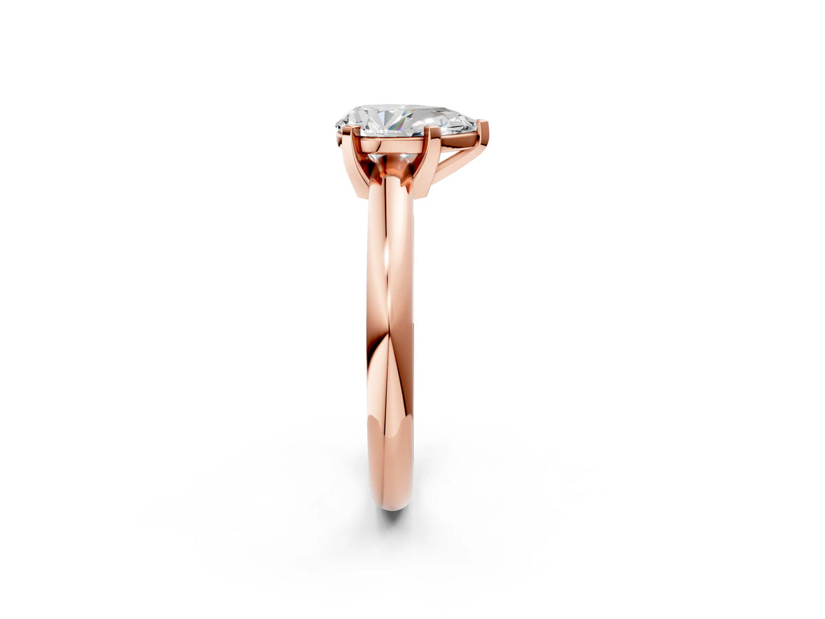 Pear Cut Diamond Solitaire Ring in Rose gold with Prong Setting and Rounded Band