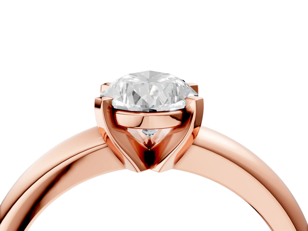 Pear Cut Diamond Solitaire Ring in Rose gold with Prong Setting and Rounded Band