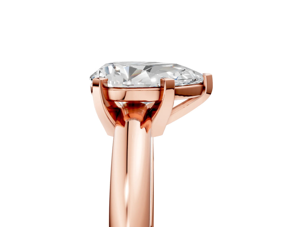 Pear Cut Diamond Solitaire Ring in Rose gold with Prong Setting and Rounded Band