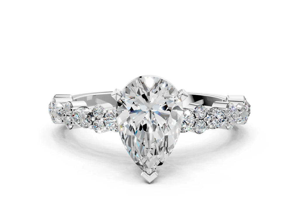 Pear Cut Diamond Solitaire Ring in Silver with Pear and Round Cluster Band