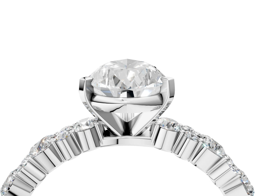 Pear Cut Diamond Solitaire Ring in Silver with Pear and Round Cluster Band