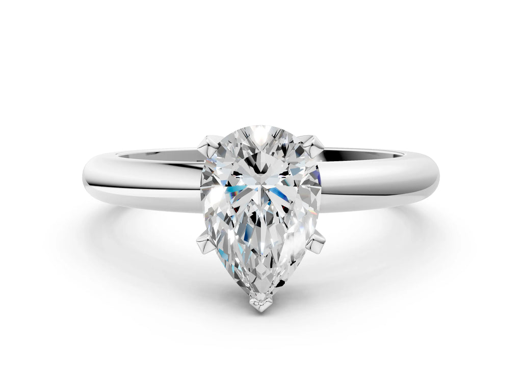 Pear Cut Diamond Solitaire Ring in Platinum with Prong Setting and Rounded Band