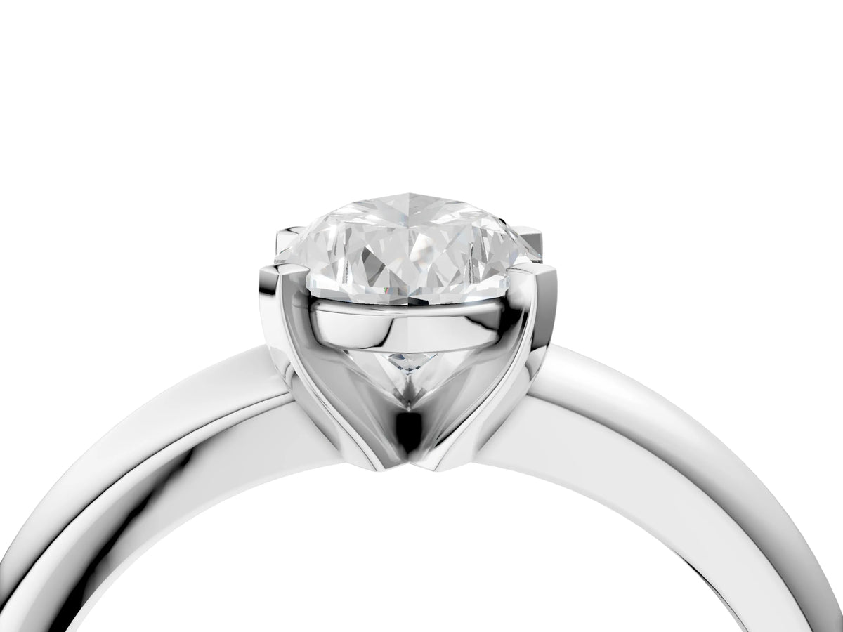 Pear Cut Diamond Solitaire Ring in Platinum with Prong Setting and Rounded Band