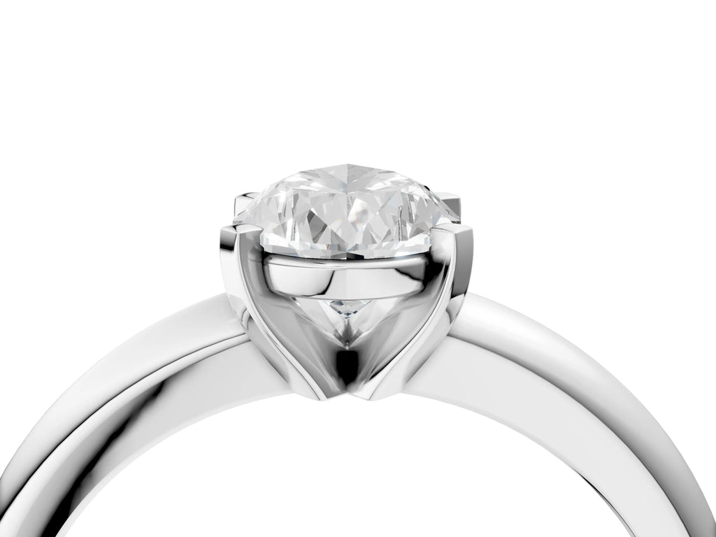 Pear Cut Diamond Solitaire Ring in Silver with Prong Setting and Rounded Band