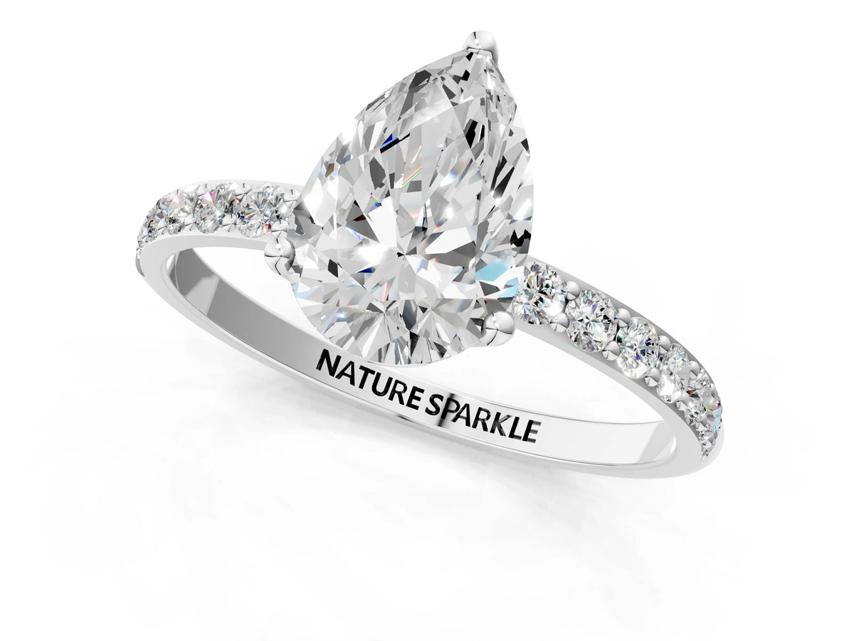 Pear Cut Diamond Solitaire Ring in Silver with Round Shared Prong Pavé Band