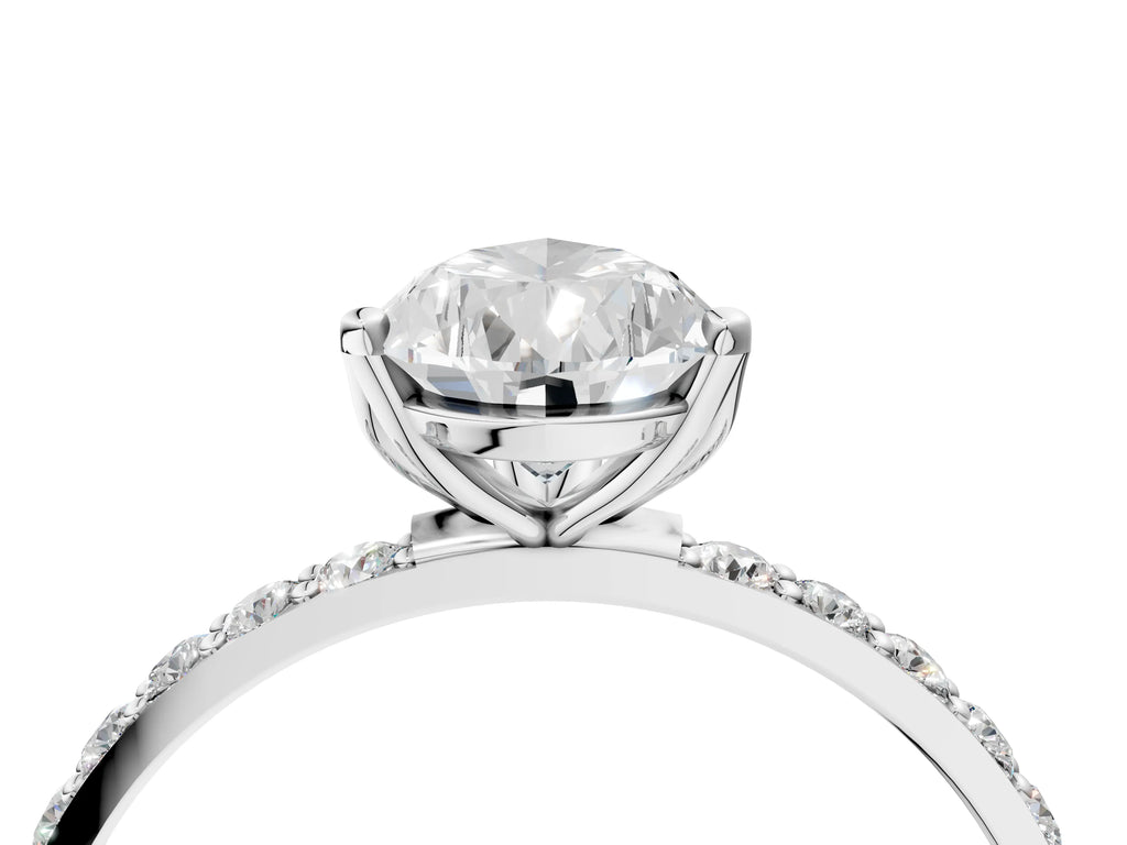 Pear Cut Diamond Solitaire Ring in Platinum with Round Shared Prong Pavé Band