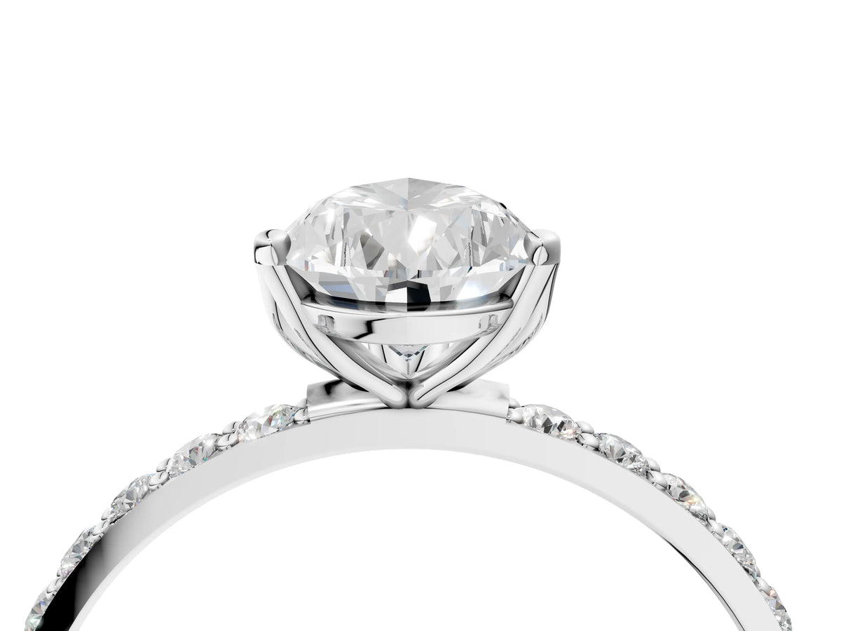 Pear Cut Diamond Solitaire Ring in Silver with Round Shared Prong Pavé Band